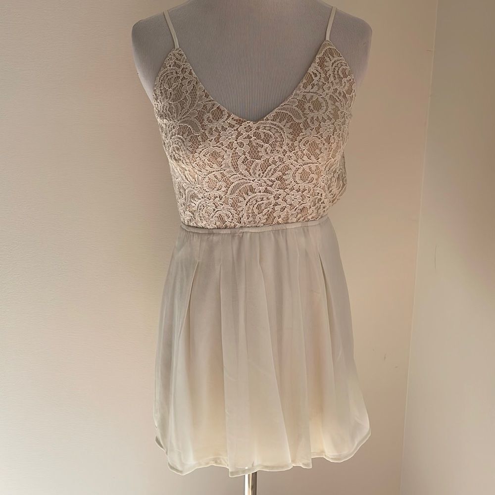Cream colored shorts romper sheer bottoms with liner lace top with tan liner XS